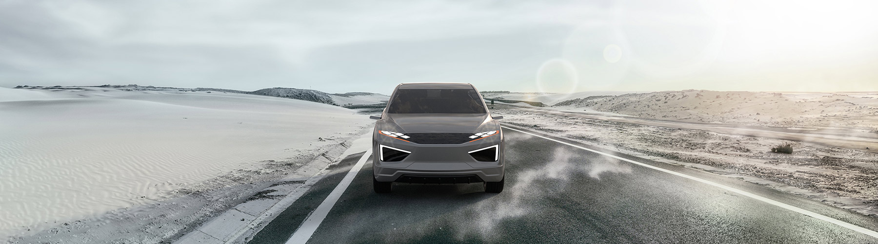 Vehicle driving along a road in the desert