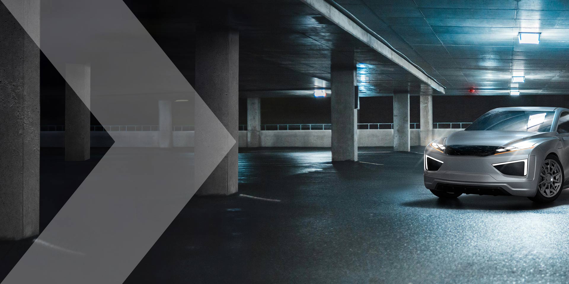 Grey vehicle in parking structure with grey chevron coming in from left side