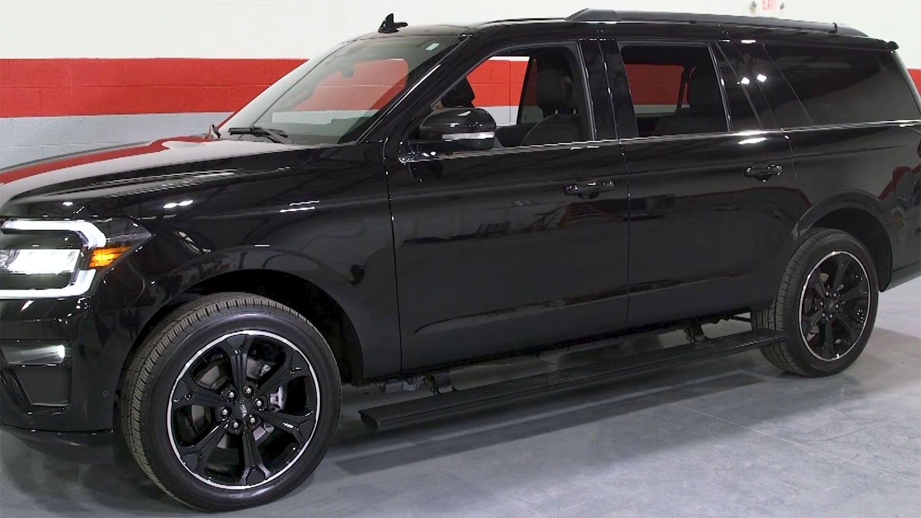 Black SUV with automated running boards
