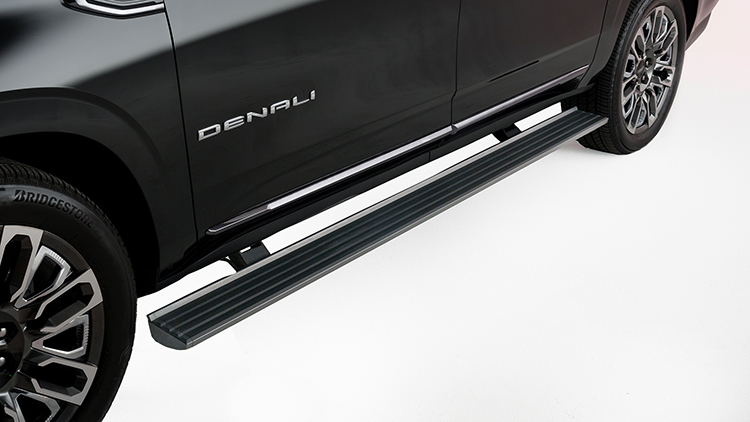 Automated running board on black SUV