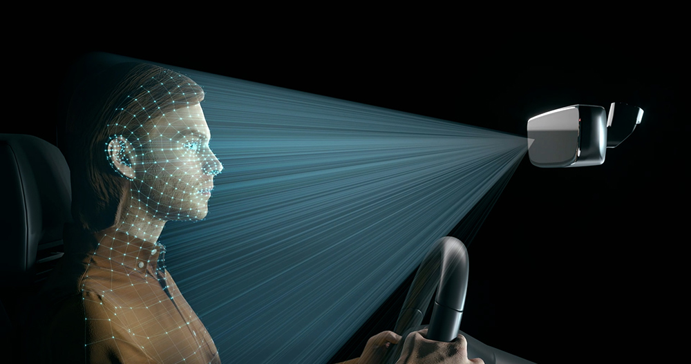 Illustration of driver monitoring system with camera integrated into rearview mirror tracking driver attention