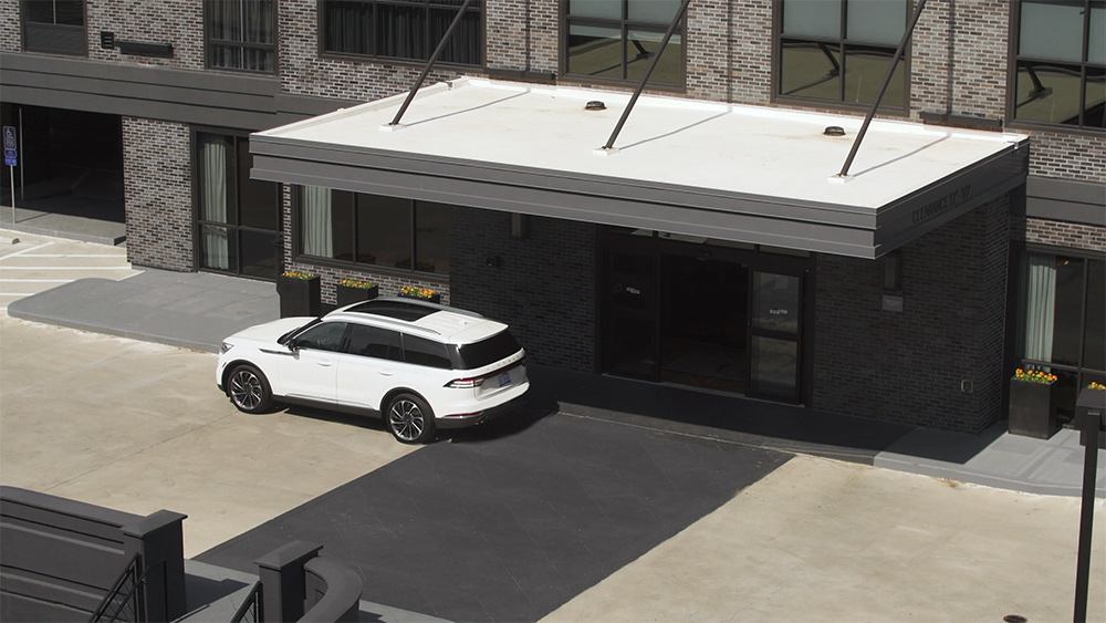 Animation of a vehicle parked outside of a building