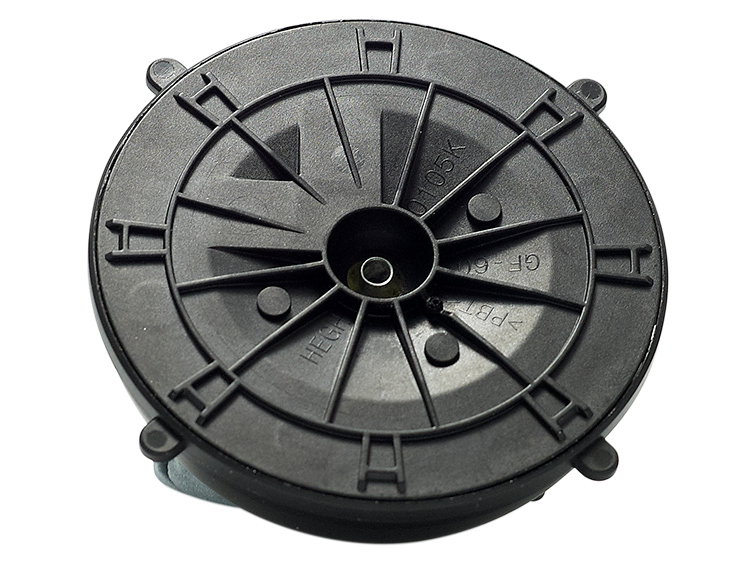 Close-up of a round automotive actuator component used for vehicle functions