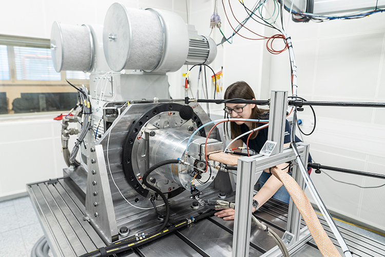 Engineer testing an eDrive component on a laboratory test bench