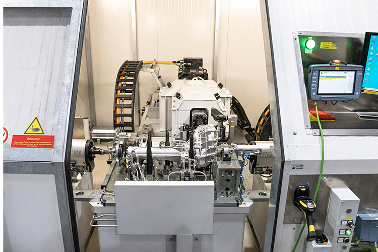 Automated machine assembling metal automotive components
