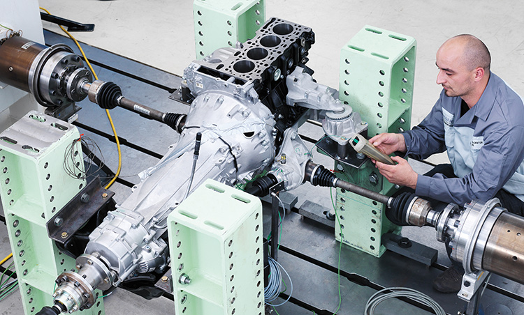 Rear view of grey vehicle taillights on with fog in background