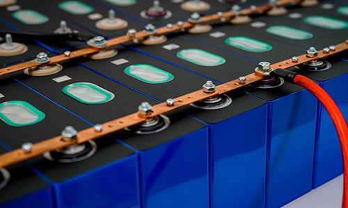 Rear view of grey vehicle taillights on with fog in background