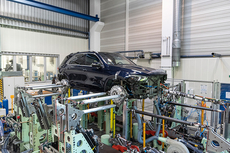 Rear view of grey vehicle taillights on with fog in background