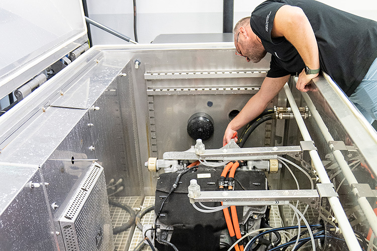 Rear view of grey vehicle taillights on with fog in background