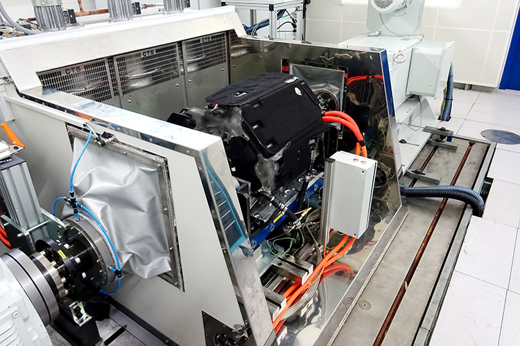 Rear view of grey vehicle taillights on with fog in background