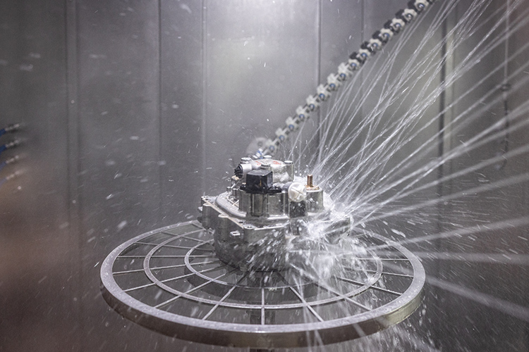 Rear view of grey vehicle taillights on with fog in background