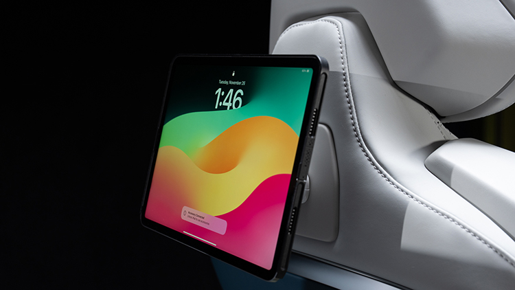 iPad attached to a universal seat adaptor integrated into a bucket seat